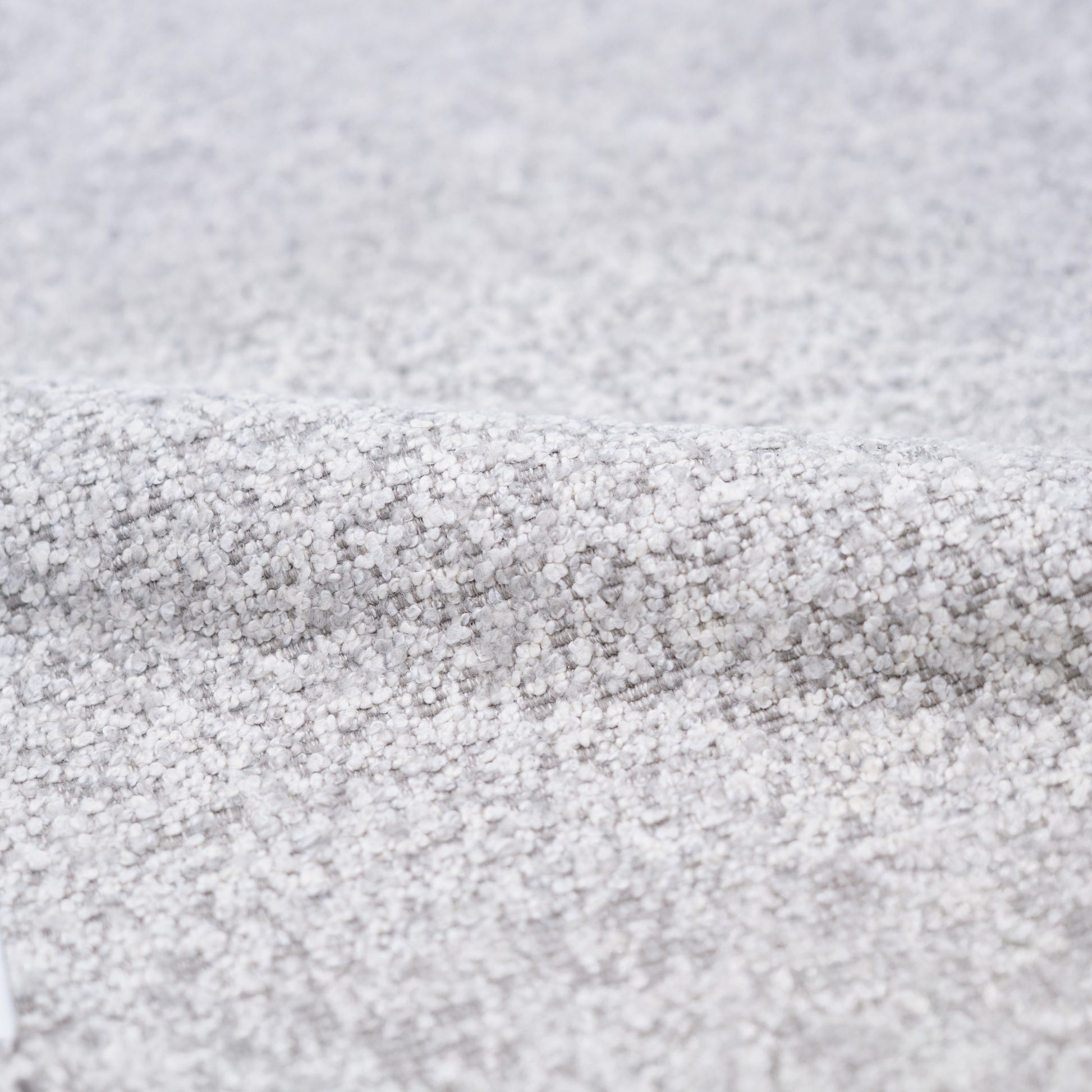 fauteuil en tissu boucle gris pied noir pivotant