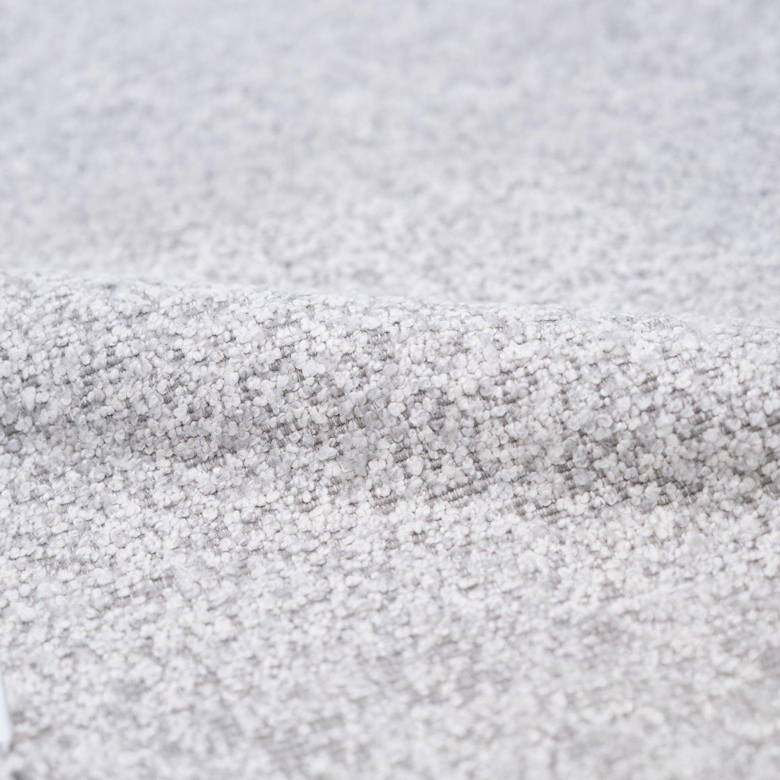 fauteuil en tissu boucle gris pied noir pivotant