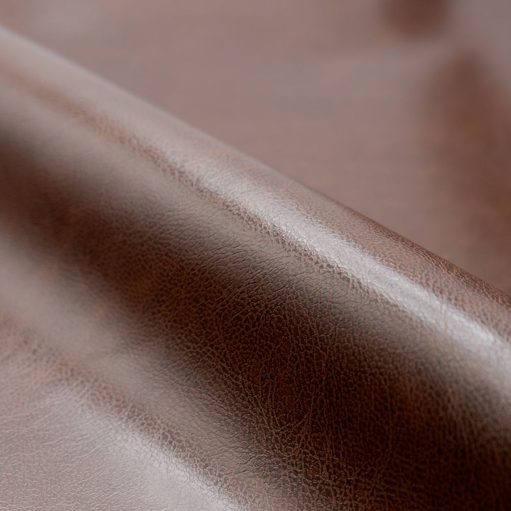 zoom matiere cuir marron fonce club